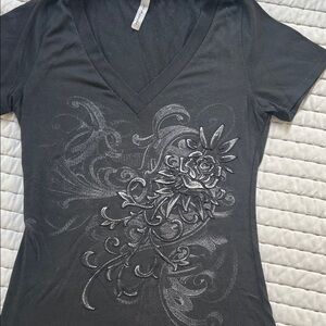 Elegant Black V-Neck Women's Tee with Graphic Design